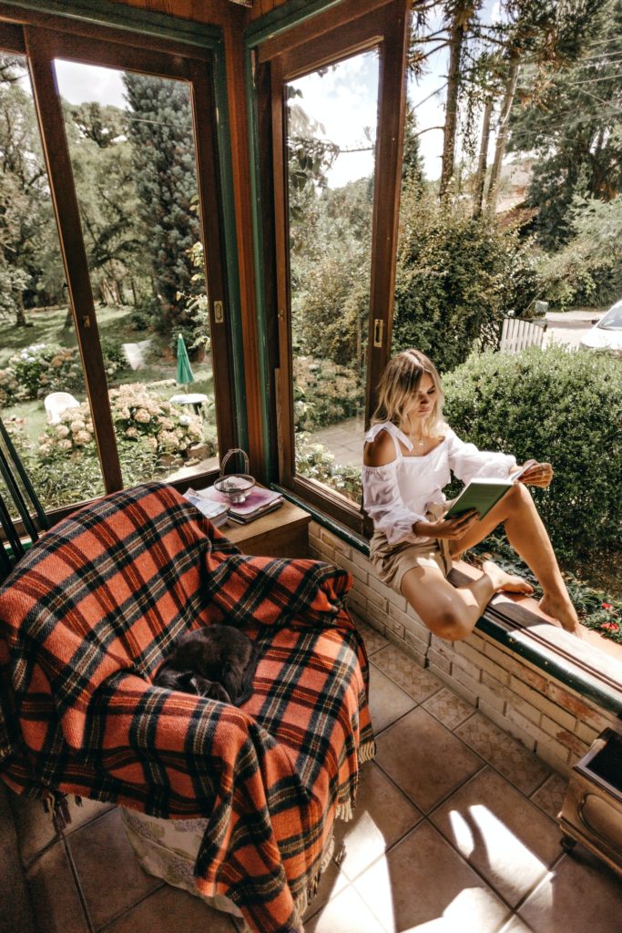 a girl reading books on how to find yourself