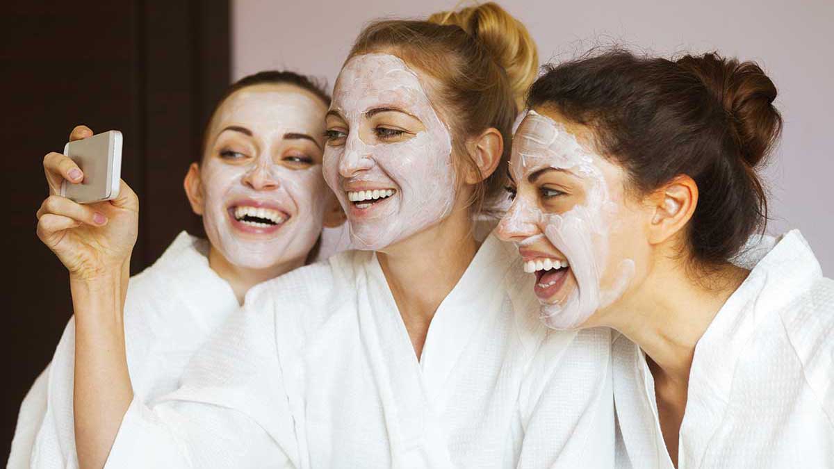 do a diy spa day with friends as a self love activity, girls wearing spa masks, group of girls