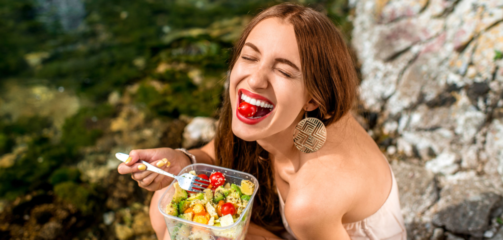 woman happily eating