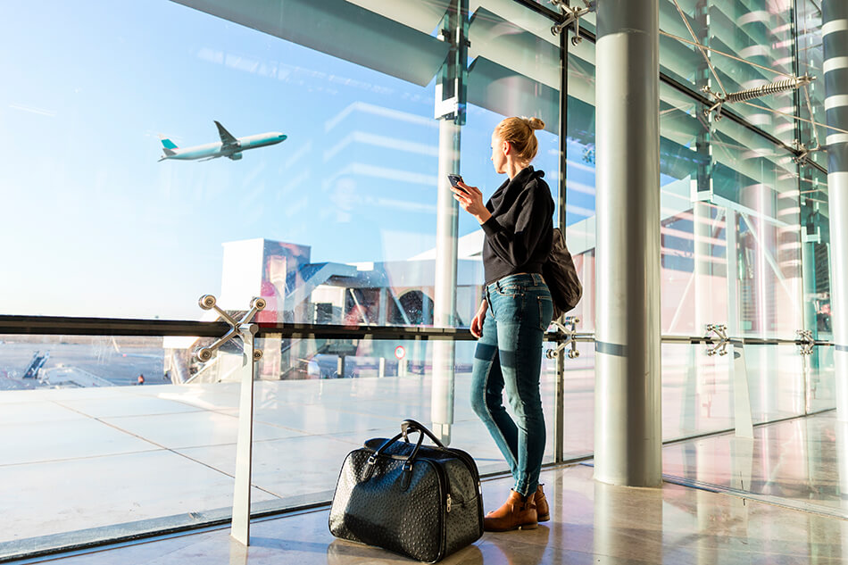 girl at the airport, save money on flights