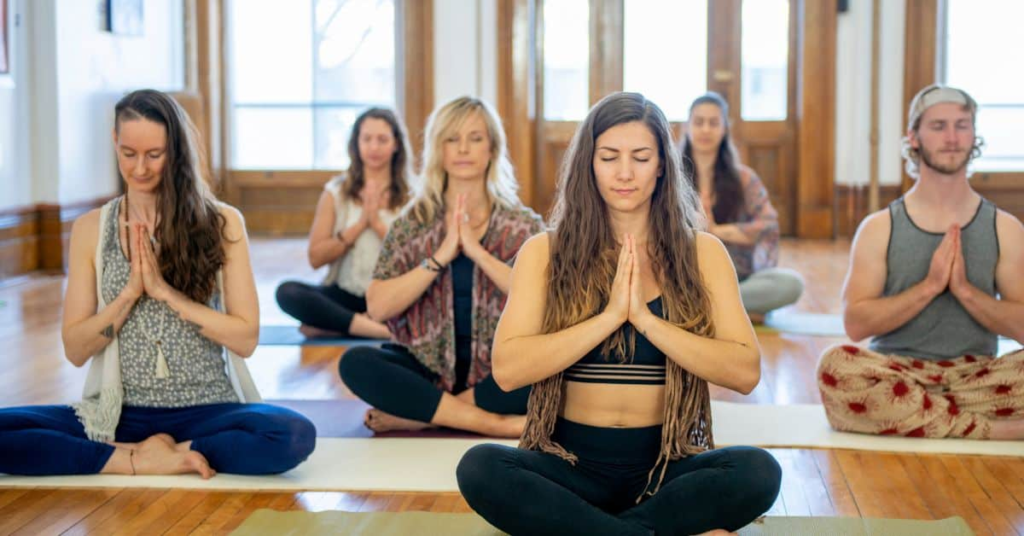 group of women meditating