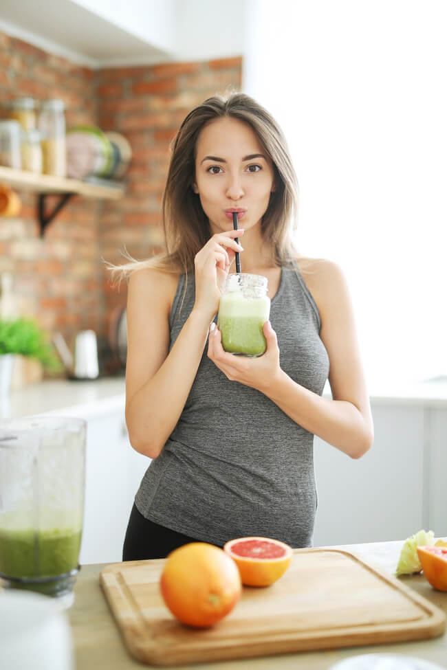 girl drinking detox juice for clear skin