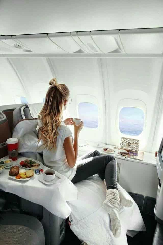 girl eating snacks on a plane